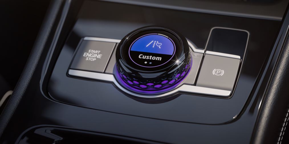 Seletor de experiências do novo Volkswagen Tiguan 2025 no console central, com controle de modos de condução e iluminação ambiente